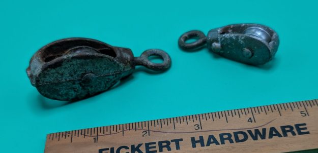 cropped-PXL_20260928_184624565.MP_-scaled-1.jpg Two Small Vintage Pulleys - Image 1
